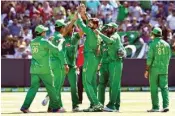  ??  ?? Pakistan bowler Imad Wasim (centre) celebrates with teammates after dismissing Australia’s Glenn Maxwell during the second one-day internatio­nal Melbourne on January 15