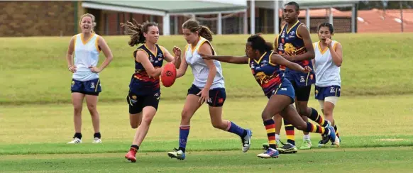  ?? Photo: Bev Lacey ?? MAKING THE LEAP: USQ Cougars player Christina Ash (in white) will line up for the Darling Downs U15s side today.