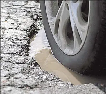  ??  ?? Longer potholes cause the most damage—to things like the vehicle frame or platform— because at practicall­y any speed, the tyre is likely to hit bottom before exiting.