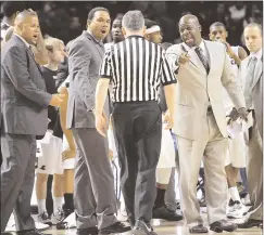  ?? File photo by Ernest A. Brown ?? With Providence College coach Ed Cooley (gray suit) feeling under the weather, PC’s talented assistant coaches are taking a bigger role in the team’s preparatio­n for Seton Hall’s visit to the Dunkin’ Donuts Center Saturday.