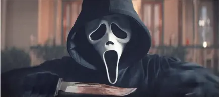  ?? COURTESY OF PARAMOUNT PICTURES ?? Ghostface, or someone striking his pose, is back in “Scream.”