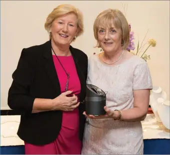  ??  ?? Joan Kinsella, winner of the Lady President’s Prize in Blainroe Golf Club receives her prize from the Lady President Bernie Nelson. Photos: Tim Thornton.