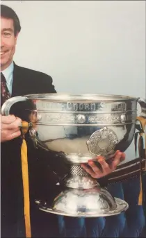  ??  ?? y with the SamMaguire Cup in 1992 when, as Chairman of the Seán he had the honour of welcoming the All-Ireland winning Donegal m to the twin towns of Ballybofey and Stranorlar.