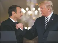  ?? ANDREW HARNIK/THE ASSOCIATED PRESS ?? French President Emmanuel Macron and President Donald Trump attend a joint news conference Tuesday. While maintainin­g a friendly relationsh­ip, the allies strain to bridge difference­s over many issues.