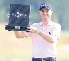  ?? AP ?? Justin Thomas poses with his trophy after winning the CJ Cup.