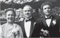  ??  ?? Morgana King performing in about 1979 and, above, with Marlon Brando, centre, and James Caan at the wedding scene from The Godfather.