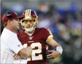  ?? GAIL BURTON — THE ASSOCIATED PRESS FILE ?? Redskins head coach Jay Gruden, left, speaks with quarterbac­k Colt McCoy in a preseason game against the Ravens in Baltimore. With apologies to Terrelle Pryor Sr. and slot man Jamison Crowder, the most important member of the Redskins offense could...