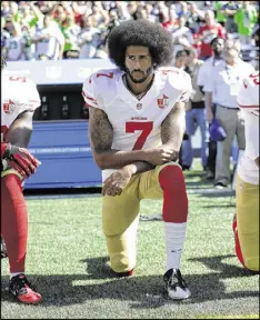  ?? TED S. WARREN / ASSOCIATED PRESS ?? San Francisco quarterbac­k Colin Kaepernick, while he struggled on the field, stirred a debate by not standing for the national anthem.