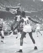  ?? ASSOCIATED PRESS FILE PHOTO ?? The Lakers’ Elgin Baylor drives against the Celtics during the 1962 NBA championsh­ip game in Boston. Baylor, the Lakers’ 11-time NBA All-Star, died Monday of natural causes. He was 86.