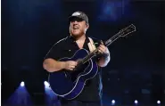  ?? AP FILE ?? Luke Combs performs during the CMA Fest in Nashville, Tenn., on June 11. Comb’s latest album, ‘Growin’ Up,’ was released on Friday.