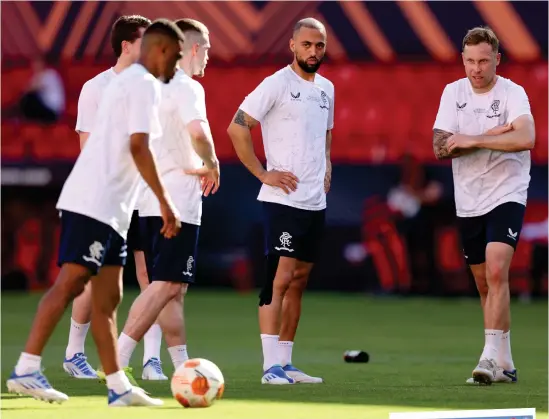  ?? ?? Recovered Rangers striker Kemar Roofe trains alongside his team-mates in Seville yesterday