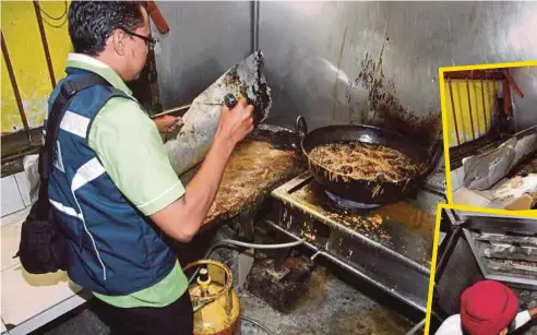  ??  ?? PENGUAT KUASA Kesihatan Pejabat Kesihatan Daerah Timur Laut membuat pemeriksaa­n terhadap Restoran Nasi Kandar Line Clear.