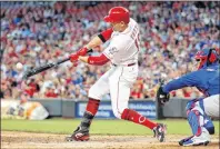  ??  ?? Cincinnati Reds’ Joey Votto hits an RBI single off Chicago Cubs starting pitcher Jake Arrieta during the fourth inning of a baseball game in Cincinnati on Aug.24. Votto of the Cincinnati Reds, a Canadian, is one of three finalists for the National...