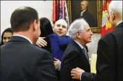  ?? ALEX BRANDON / AP ?? Joshua Holt (center), who was recently released from a prison in Venezuela, hugs Rep. Mia Love, R-Utah, (left) in the Oval Office on Saturday as Sen. Bob Corker, R-Tenn., (second from right) talks with Sen. Orrin Hatch, R-Utah. At left is Holt’s wife,...