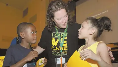  ?? STAFF FILE PHOTO BY ANGELA ROWLINGS ?? ‘THERE FOR THEM’: Curley K-8 principal Katie Grassa, with second graders Che-arye Campbell, left, and Kailey Pimentel in 2016, wants her students involved in planning help for Houston schools.