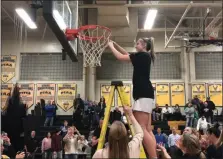  ?? ANDREW ROBINSON/MEDIANEWS GROUP ?? Central Bucks West’s Maddie Burke cuts down a piece of the net after the Bucks’ clinched the SOL Continenta­l title with a win over North Penn on Friday.