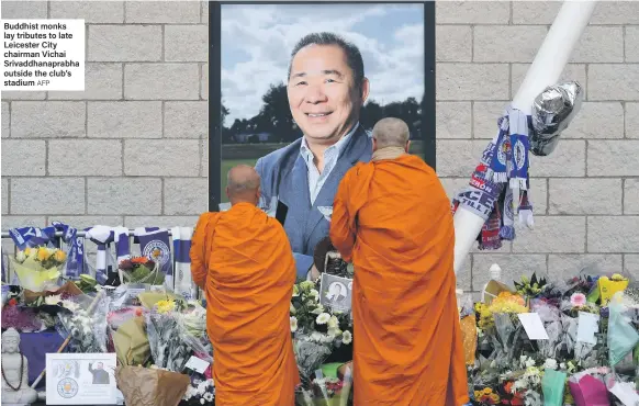  ?? AFP ?? Buddhist monks lay tributes to late Leicester City chairman Vichai Srivaddhan­aprabha outside the club’s stadium