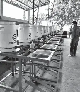  ??  ?? Foot-operated hand-washing facilities in Maco, Davao de Oro