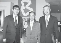  ??  ?? Azman (centre) having a light moment with Kawai (left) and Miyagawa at Wisma Bernama. — Bernama photo