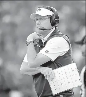  ?? AP/RAINIER EHRHARDT ?? Auburn Coach Gus Malzahn watches during the first half of Saturday’s game against Clemson on Saturday in Clemson, S.C.