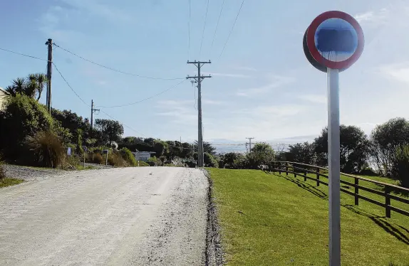  ?? PHOTO: BEN TOMSETT ?? Gone and forgotten . . . The 100kmh signs were added to the entrance of Omaui village by the Invercargi­ll City Council on Wednesday, vandalised with graffiti on Thursday and subsequent­ly covered up by the council yesterday, with plans for later removal.