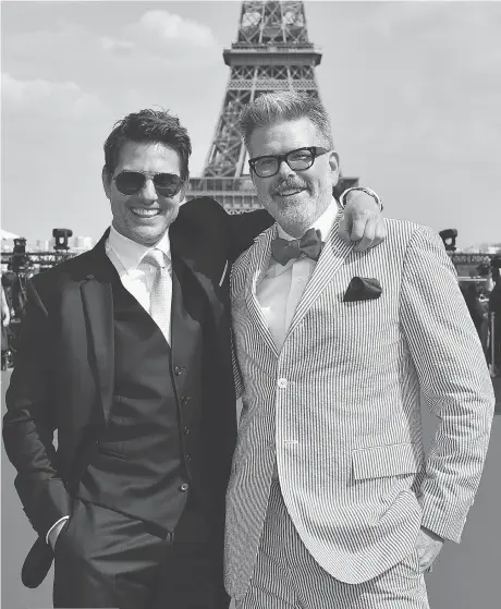  ?? GETTY IMAGES ?? Director Christophe­r McQuarrie, right, seen with Mission: Impossible — Fallout star Tom Cruise at the Paris première of the new action flick, is the first director to return to a Mission: Impossible sequel.