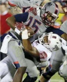  ?? THE ASSOCIATED PRESS FILE ?? Temple linebacker Haason Reddick, shown tackling UConn quarterbac­k Donovan Williams (15), would presumably be welcomed by local fans if the Eagles select him at No. 14 in Thursday’s first round of the NFL Draft.