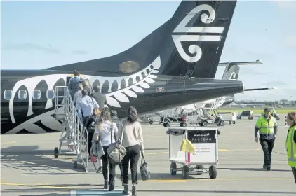  ?? AP ?? Passengers board an Air New Zealand flight at Christchur­ch Airport in 2017. New Zealand’s national carrier admitted a registrati­on mistake turned back a flight to China over the weekend.