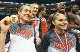  ?? Ozan Kose / AFP/ Getty Images ?? Breanna Stewart, Lindsay Whalen, Diana Taurasi and Nneka Ogwumike pose with their medals after winning the world championsh­ip.