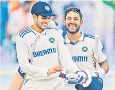  ?? file photo — AFP ?? India’s Shubman Gill (left) and Dhruv Jurel celebrate their win at the end of the fourth day of the fourth Test cricket match between India and England at the Jharkhand State Cricket Associatio­n (JSCA) Stadium in Ranchi.