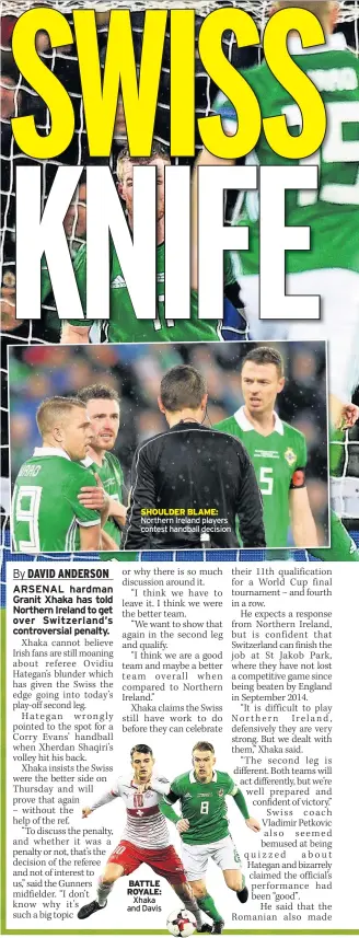  ??  ?? SHOULDER BLAME: Northern Ireland players contest handball decision BATTLE ROYALE: Xhaka and Davis