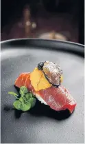  ?? CRAVE IMAGERY THE NEW YORK TIMES ?? A serving of bluefin tuna nigiri with uni, black truffle and sturgeon caviar at Hidden Fish restaurant in San Diego.