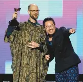  ?? CHRIS PIZZELLO/AP ?? Daniel Scheinert, left, and Daniel Kwan accept the trophy for best director for“Everything Everywhere All at Once” Saturday at the Spirit Awards.