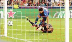  ??  ?? Zagreb’s El Arabi Hilal Soudani (up) vies with Salzburg’s goalkeeper Alexander Walke during the Uefa Champions League qualificat­ion play-offs match.