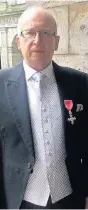  ??  ?? Honour John wears with pride his MBE he received from the Queen
