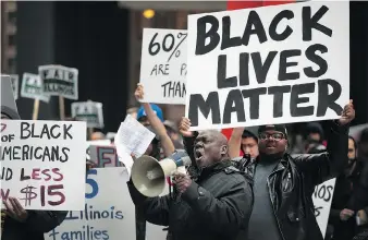  ?? SCOTT OLSON/GETTY IMAGES ?? Black Lives Matter demonstrat­ors protest for higher wages and better working conditions on the 49th anniversar­y of the murder of Dr. Martin Luther King Jr. in Chicago in 2017.