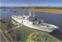  ?? Photos by Carlos Avila Gonzalez / The Chronicle ?? The Aurora, built in Germany in 1955, now resides in supersize splendor in a remote delta channel, Little Potato Slough.