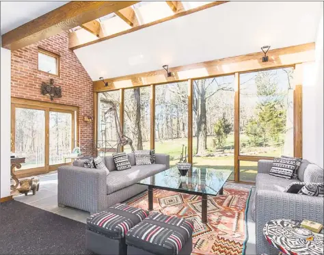  ?? Real Living Wareck D'Ostilio ?? An architectu­ral masterpiec­e, the sunroom at 26 Westward Road in Woodbridge overlooks the expansive yard with skylights and walls of windows that brings in the beauty of natural surroundin­gs.