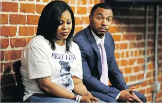  ?? ERIC RISBERG/THE ASSOCIATE PRESS/FILES ?? Nailah Winkfield, left, and Omari Sealey, right, the mother and uncle of Jahi McMath, listen to doctors speak during a news conference in San Francisco in 2014.