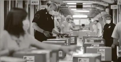  ??  ?? STRUGGLING TO KEEP UP: Vault workers struggle to keep up as secure packages containing the only Ohio State Restricted Silver Bank Rolls known to exist loaded with solid .999 U.S. State Silver continue to fly out the door from the private vaults of the National Mint and Treasury to Ohio residents who call 1-800-955-3792 before the 2–day deadline ends.