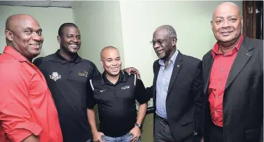  ?? BROWN/PHOTOGRAPH­ER RUDOLPH ?? From left: Arnett Gardens FC assistant coach Eugene Williams, Portmore United head coach Shavar Thomas, FLOW Vice-President of Marketing Carlo Redwood, Profession­al Football Associatio­n of Jamaica Chairman Don Anderson, and Jamaica Football Federation...