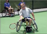  ??  ?? File, Doug Walker / Rome News-Tribune
Jodie Lawhead returns a shot during wheelchair tennis lessons at the Rome Tennis Center at Berry College.