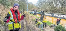  ?? PHOTOS: CRT ?? The students helping the Canal & River Trust plant trees alongside the Trent & Mersey Canal.
