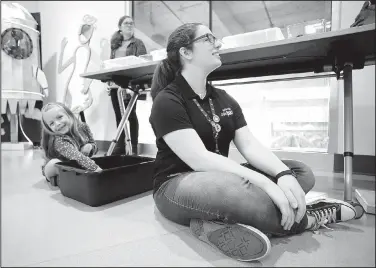  ?? NWA Democrat-Gazette/DAVID GOTTSCHALK ?? Maggi Hourigan, 6, uses the Bird Beak Buffet on Monday with its creator Rebecca Vukin, a graduate of Bentonvill­e High School, during a celebratio­n for students who participat­ed in the MakeHER Squad programs at the Amazeum in Bentonvill­e. The squad...