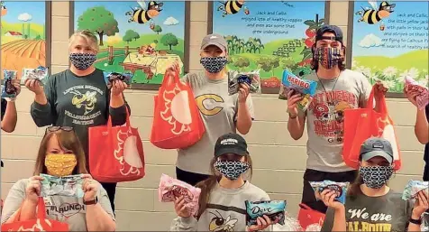  ?? Contribute­d ?? Calhoun’s Mask Angels donated 90 masks to the school nutrition department and bus drivers at Calhoun City Schools after a request came in urgently requesting help. In total, they’ve donated more than 2,500 masks around the community.