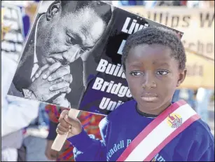  ?? K.M. Cannon Las Vegas Review-Journal @KMCannonPh­oto ?? Jayce Jordan, 4, prepares to march with Williams Elementary School classmates in last year’s parade.