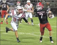  ?? Larry Greeson ?? Sonoravill­e senior Blade Bryant runs with the ball during the Phoenix’s game against the Haralson County Rebels at Sonoravill­e High School on Oct. 11.