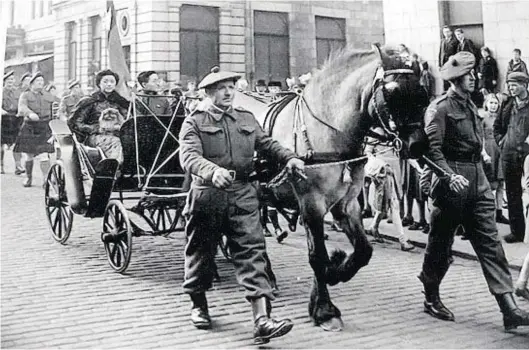  ?? Photograph: Frank Smith, Alford ?? An entourage on Union Street in Aberdeen during China Week, during World War II in 1943.