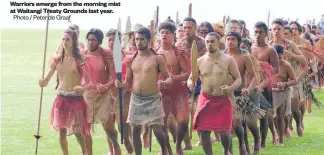  ?? Photo / Peter de Graaf ?? Warriors emerge from the morning mist at Waitangi Treaty Grounds last year.