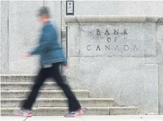  ?? ADRIAN WYLD THE CANADIAN PRESS FILE PHOTO ?? A new survey by the Bank of Canada suggested that business sentiment in the country has edged higher, but difference­s between the Prairies and Central Canada have grown more pronounced.